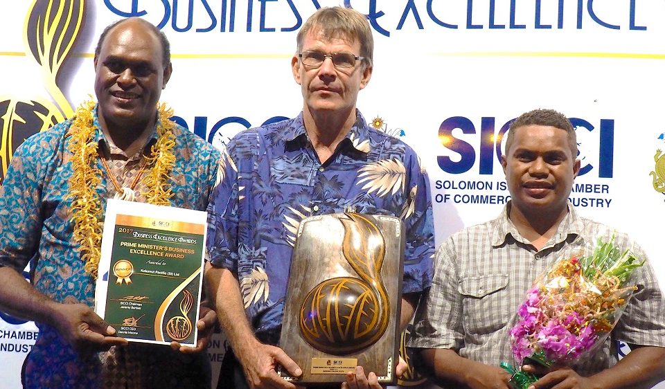 John Maneniaru, MP presented the Prime Minister’s Business Excellence Award to Bob Pollard (center) and Douglas Doli of Kokonut Pacific Solomon Islands